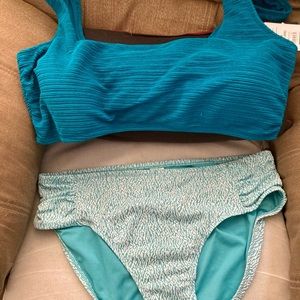 Two pieces of swimwear with tags. NEW WITH CURRENT TAGS!